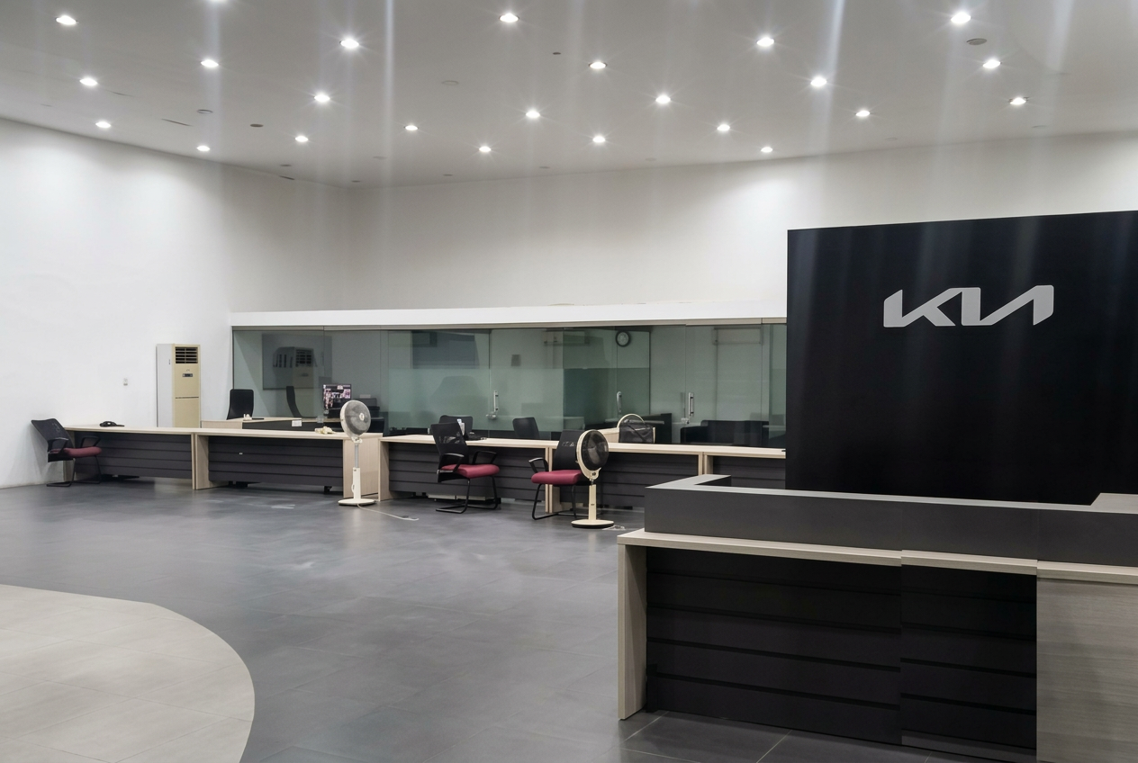 Actual Kalma Motors showroom with reception, consultation desks and glazed offices